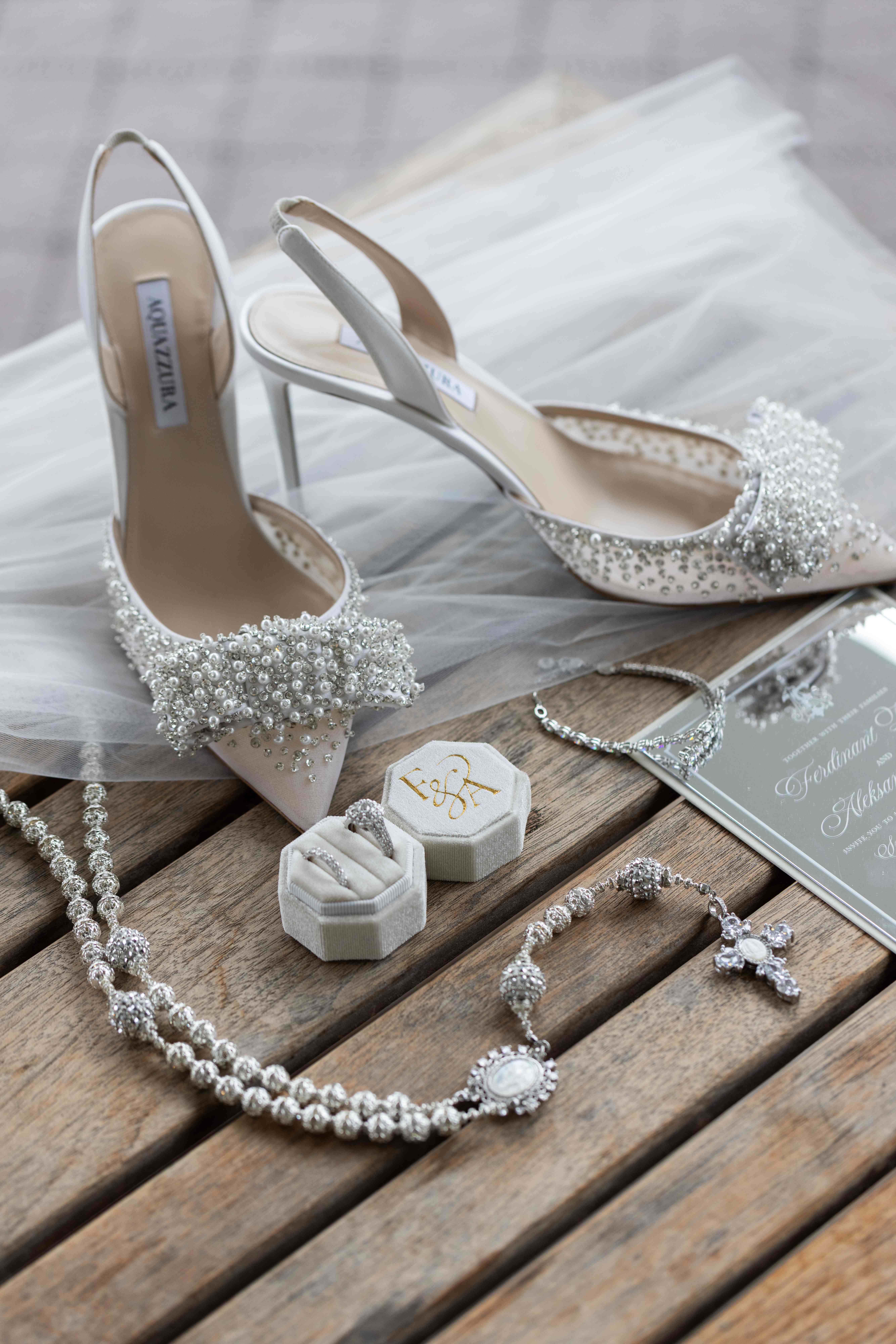 Wedding day details including sparkly bridal shoes, jewelry, and invitation